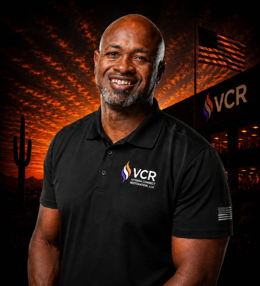 Smiling worker in VCR polo shirt at sunset